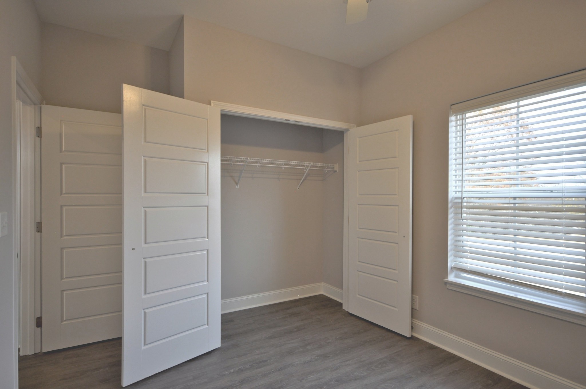 172 Bainbridge Drive, Unit B Clarksville, TN 37043 - Photo 21 of 35 an empty room with wooden floor closet and windows