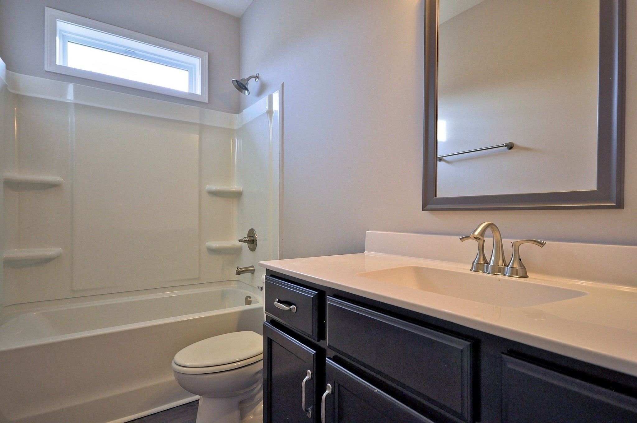 172 Bainbridge Drive, Unit B Clarksville, TN 37043 - Photo 22 of 35 a bathroom with a sink a toilet and shower