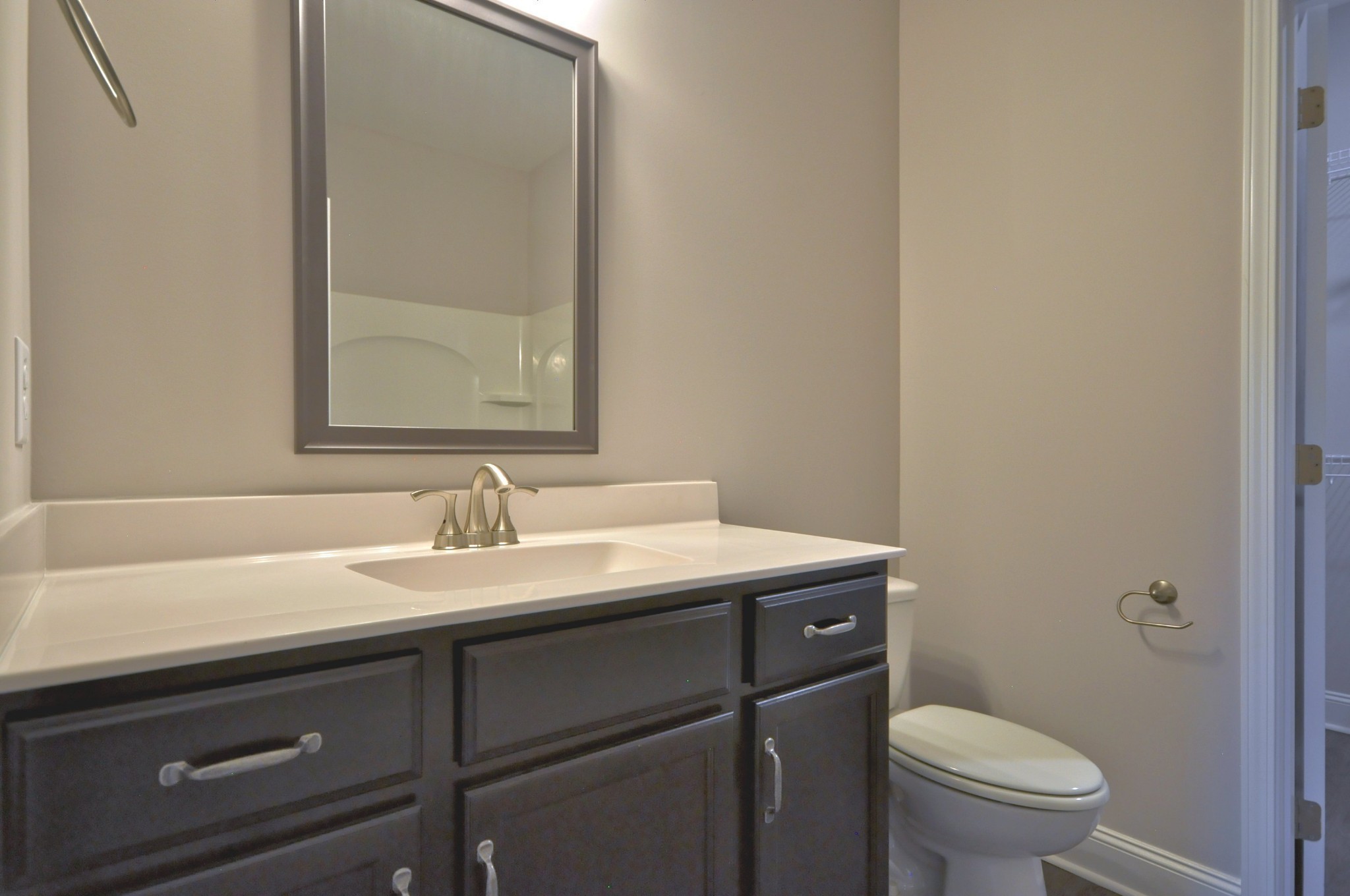 172 Bainbridge Drive, Unit B Clarksville, TN 37043 - Photo 27 of 35 a bathroom with a granite countertop sink toilet and mirror