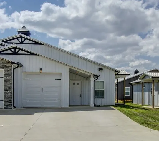 a front view of a house with a garage