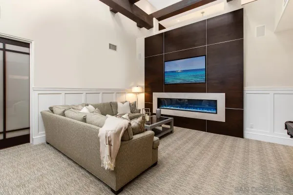 a living room with a couch and a fireplace