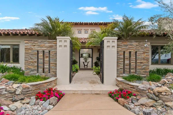 a front view of a house with a garage