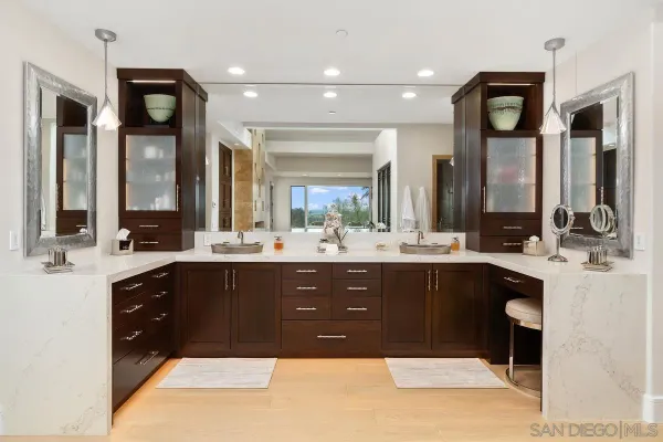 a spacious bathroom with a sink vanity and mirror