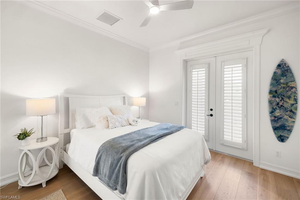 950 8th Street South Naples, FL 34102 - Photo 16 of 21 a bedroom with a bed and a window