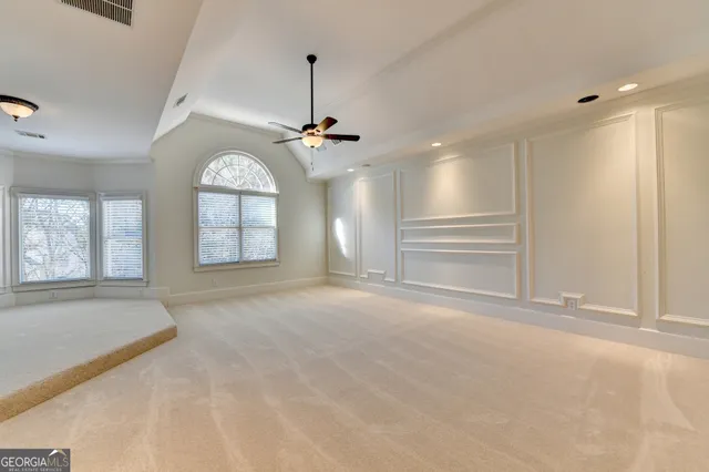 a en suite bathroom with a granite countertop sink and a mirror