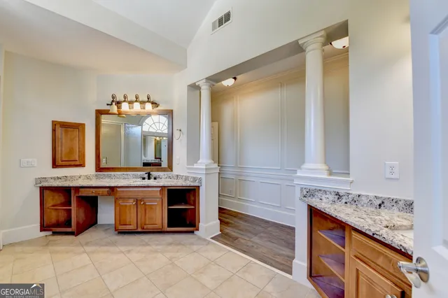 a view of a room with wooden floor and exposed radiator
