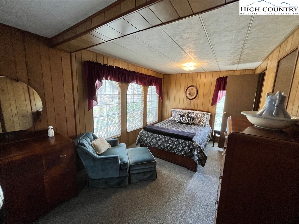 164 Smith Road Deep Gap, NC 28618 - Photo 11 of 16 a living room with furniture and a flat screen tv