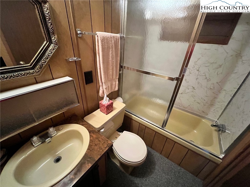 164 Smith Road Deep Gap, NC 28618 - Photo 15 of 16 a bathroom with a sink toilet and shower