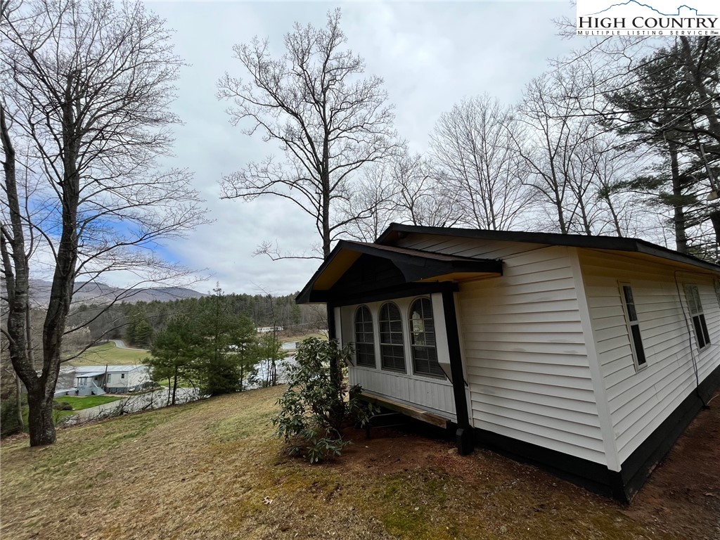 164 Smith Road Deep Gap, NC 28618 - Photo 6 of 16 a view of a house with a yard
