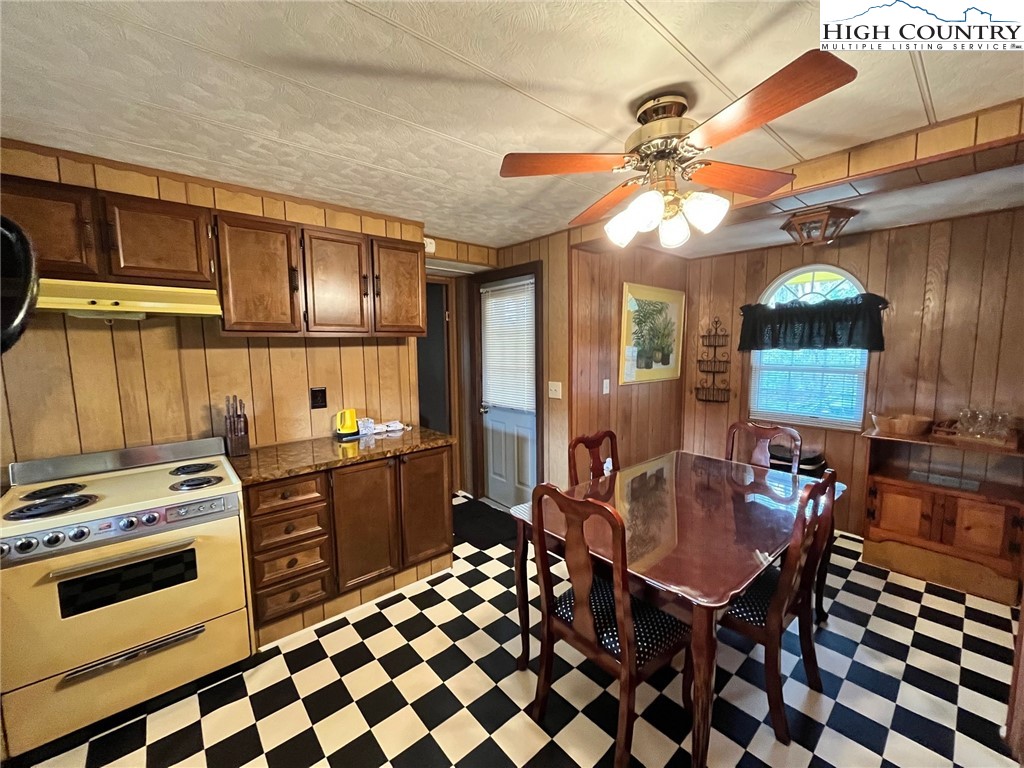 164 Smith Road Deep Gap, NC 28618 - Photo 8 of 16 a kitchen with a sink a stove and chairs