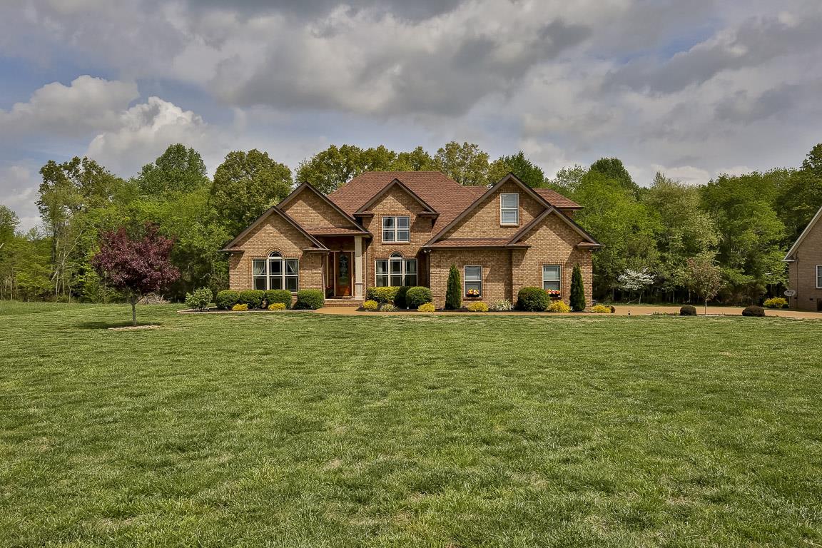 223 Butler Bridge Road Portland, TN 37148 - Photo 1 of 30 a front view of a house with a garden