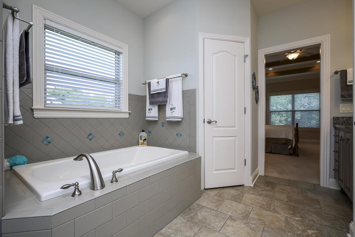 223 Butler Bridge Road Portland, TN 37148 - Photo 19 of 30 a bathroom with a bathtub and a sink