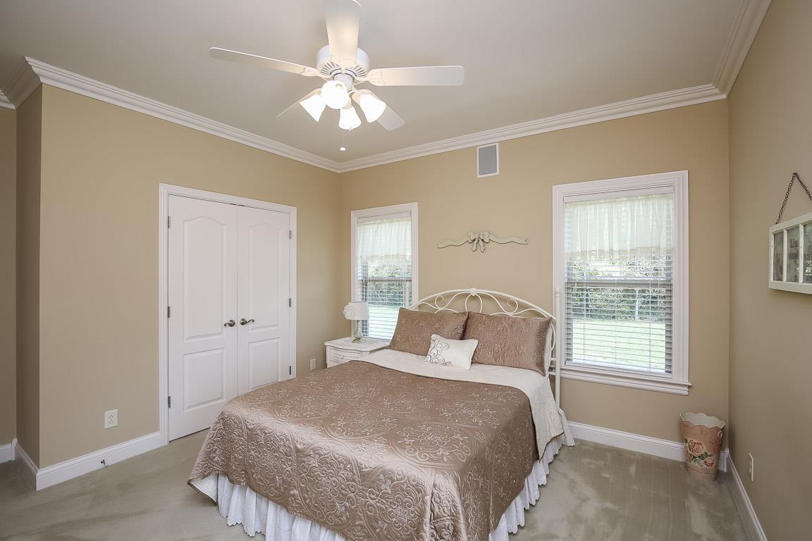 223 Butler Bridge Road Portland, TN 37148 - Photo 23 of 30 a bedroom with a large bed and a window
