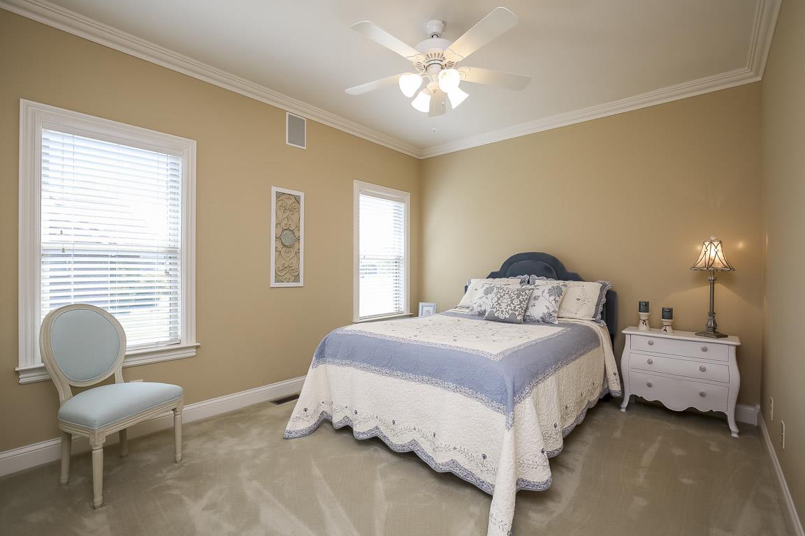 223 Butler Bridge Road Portland, TN 37148 - Photo 24 of 30 a bedroom with a bed and a chair