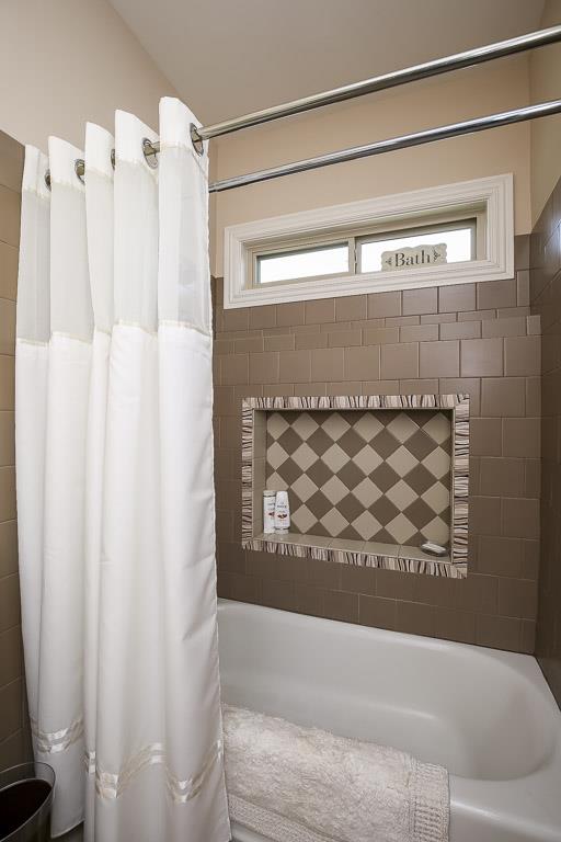 223 Butler Bridge Road Portland, TN 37148 - Photo 26 of 30 a bathroom with a bathtub and shower