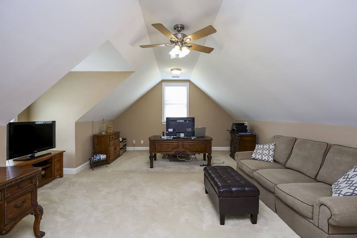 223 Butler Bridge Road Portland, TN 37148 - Photo 28 of 30 a living room with furniture and a flat screen tv