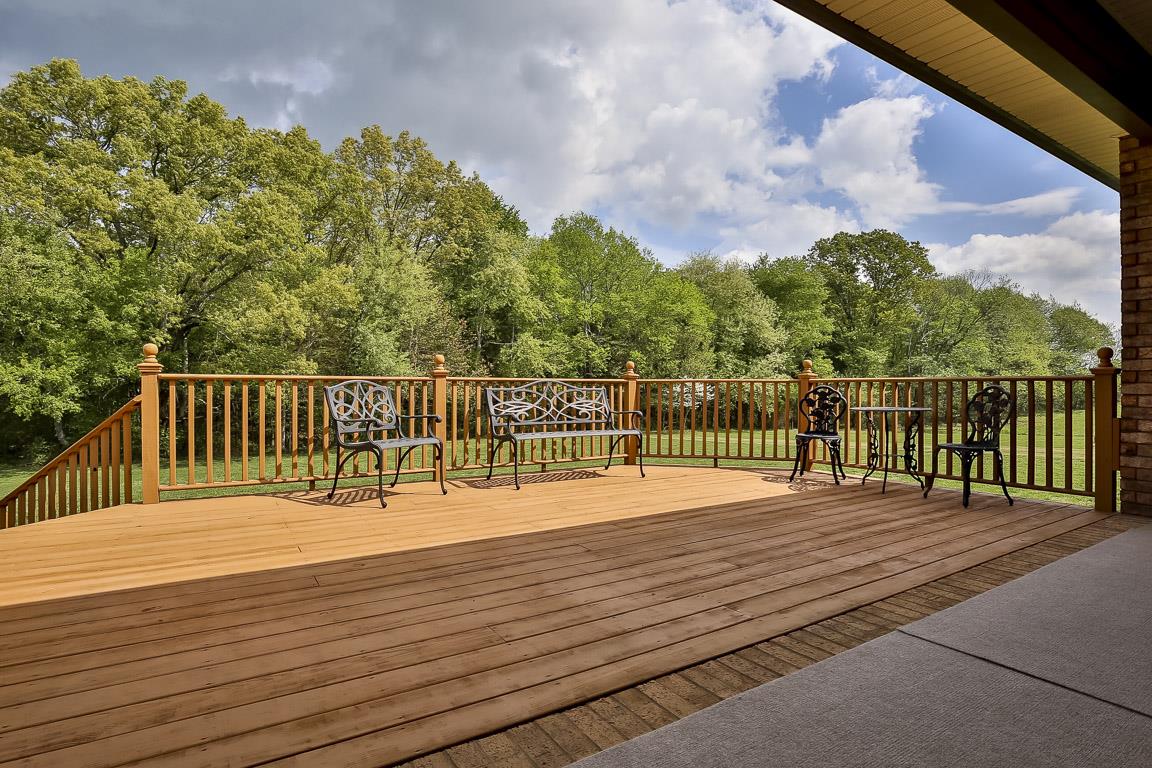 223 Butler Bridge Road Portland, TN 37148 - Photo 4 of 30 a balcony with wooden floor