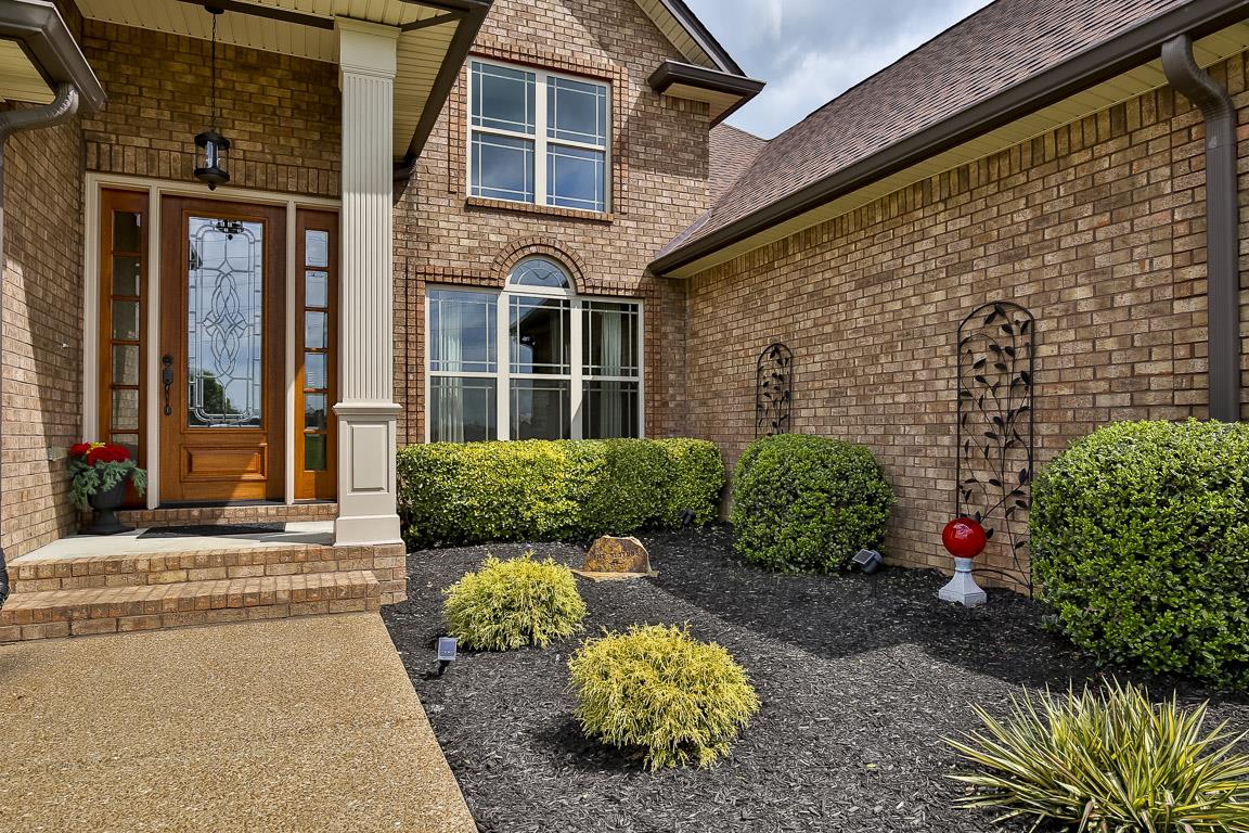 223 Butler Bridge Road Portland, TN 37148 - Photo 5 of 30 a view of a brick house with a yard