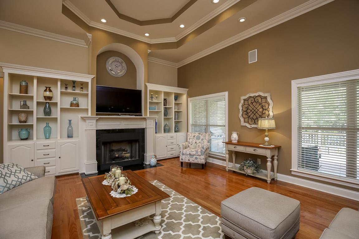 223 Butler Bridge Road Portland, TN 37148 - Photo 10 of 30 a living room with furniture a fireplace and a flat screen tv