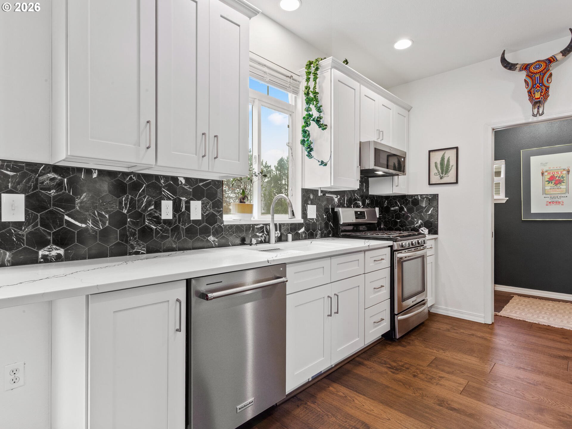 19200 Southeast 33rd Circle Camas, WA 98607 - Photo 11 of 43 a kitchen with granite countertop white cabinets and white appliances
