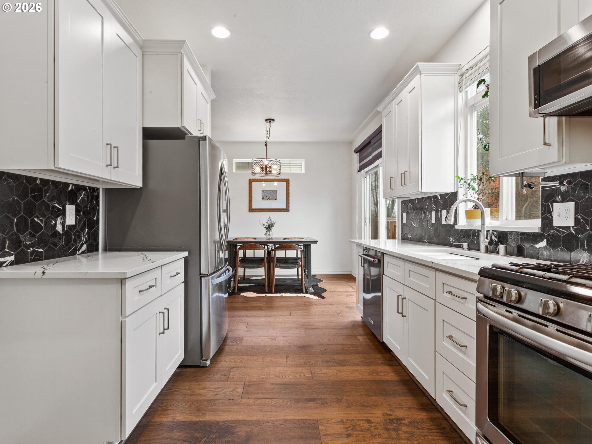 19200 Southeast 33rd Circle Camas, WA 98607 - Photo 13 of 43 a kitchen with white cabinets and appliances