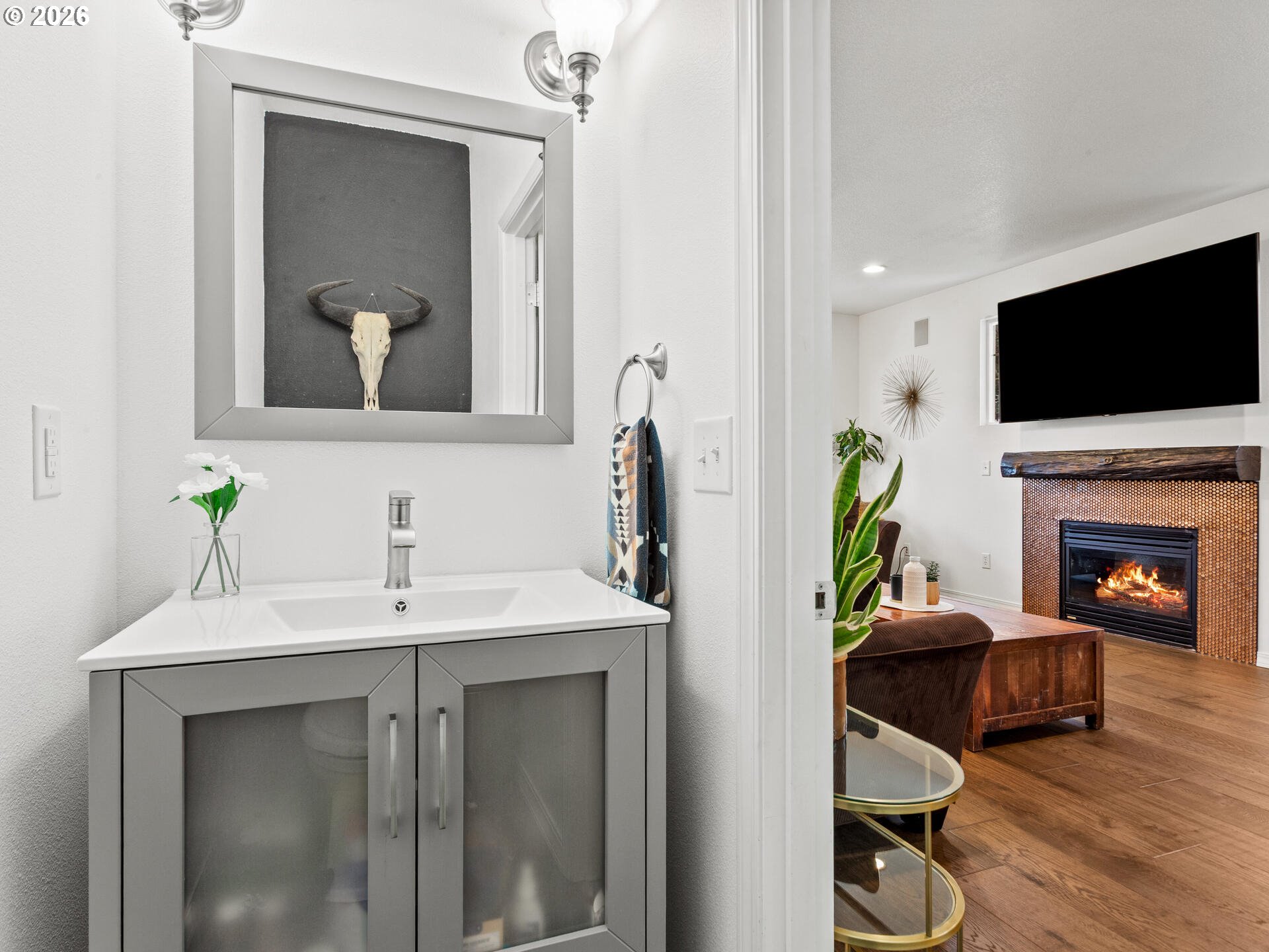 19200 Southeast 33rd Circle Camas, WA 98607 - Photo 15 of 43 a living room with furniture a flat screen tv and a fireplace