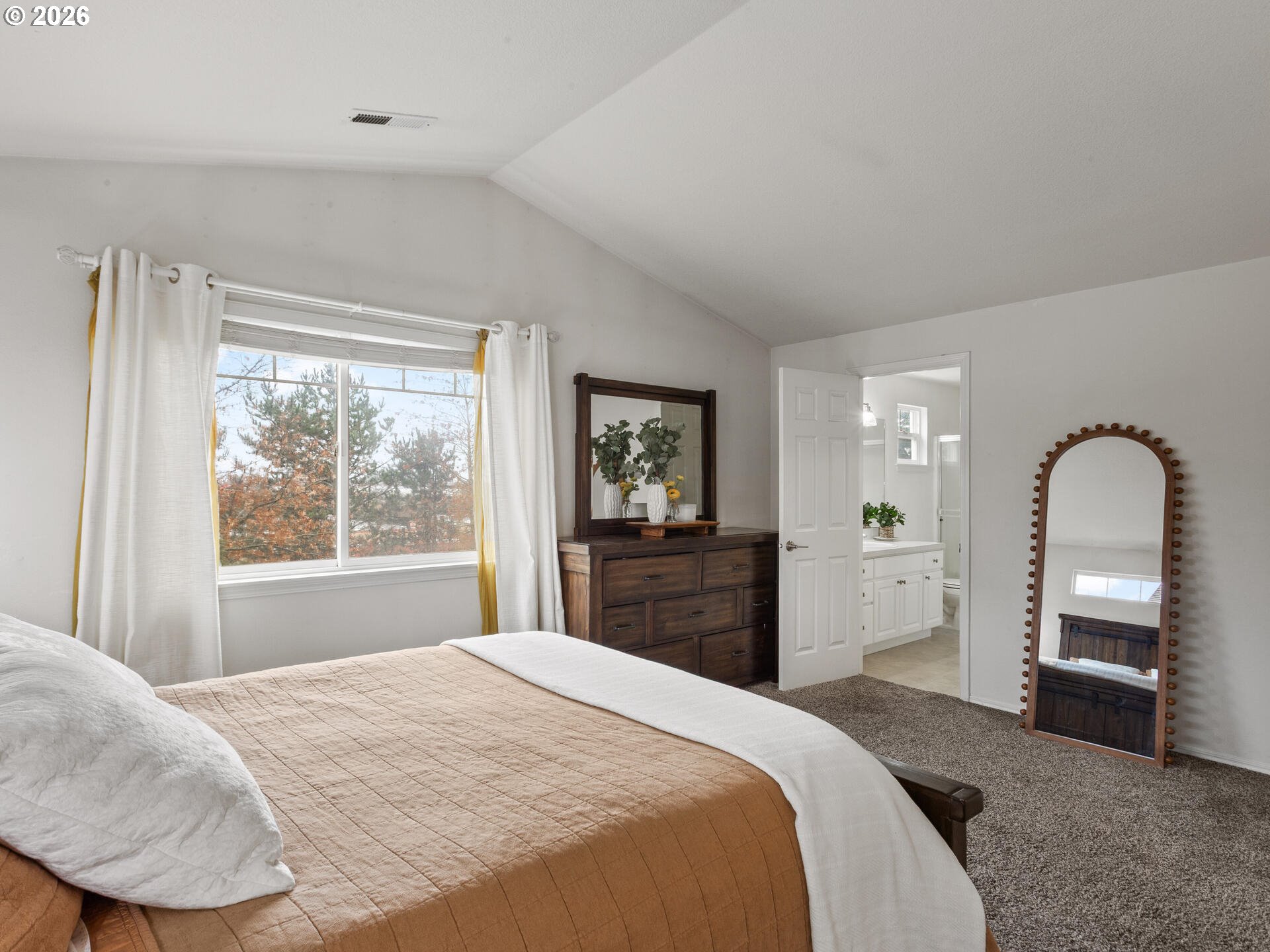 19200 Southeast 33rd Circle Camas, WA 98607 - Photo 20 of 43 a bedroom with a bed and dresser with mirror