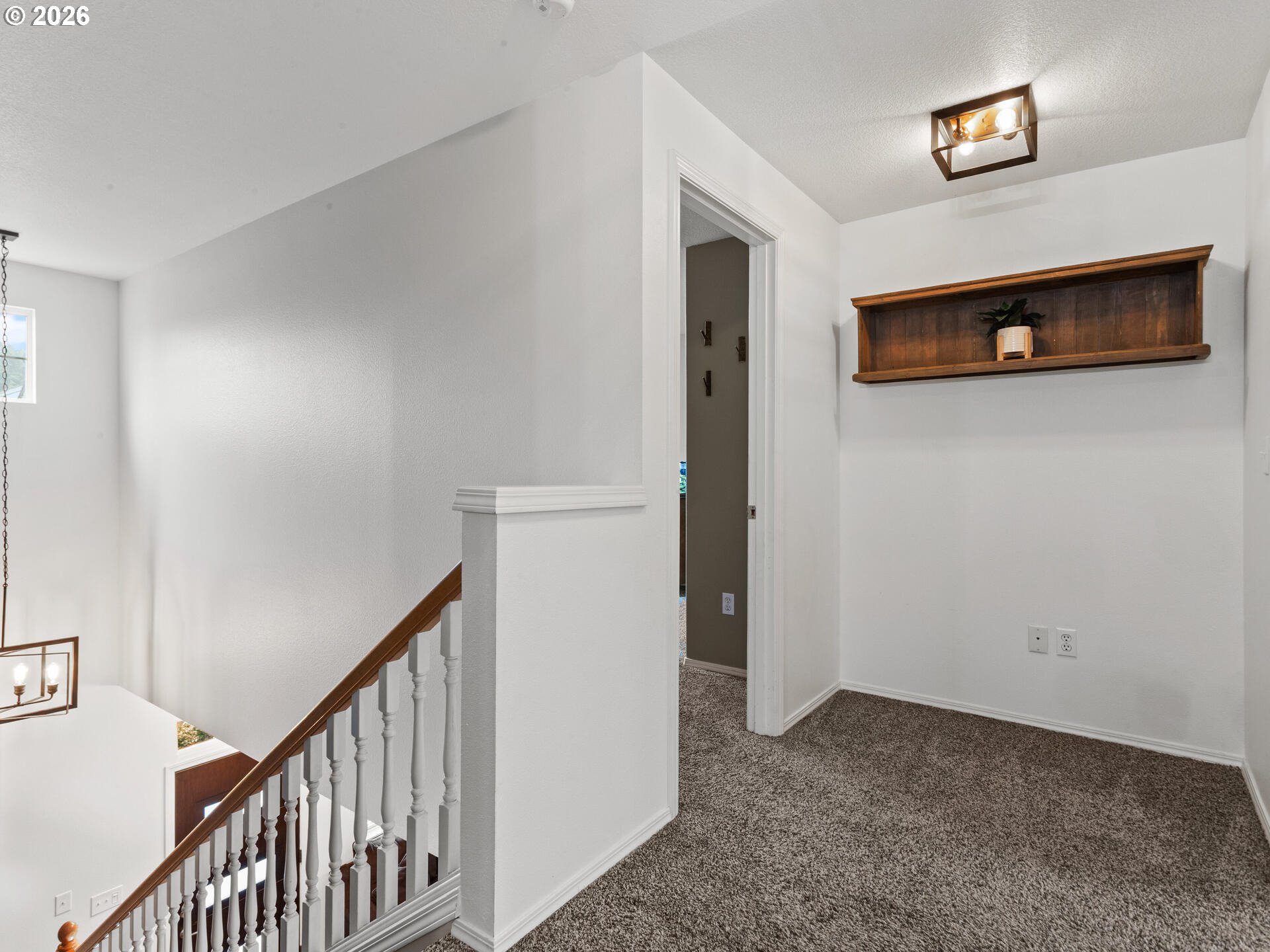 19200 Southeast 33rd Circle Camas, WA 98607 - Photo 24 of 43 a view of a hallway with wooden floor and a bathroom