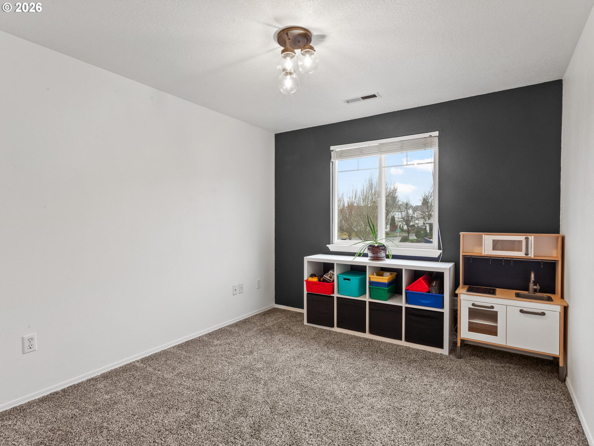 19200 Southeast 33rd Circle Camas, WA 98607 - Photo 27 of 43 a view of game room with window and kitchen view