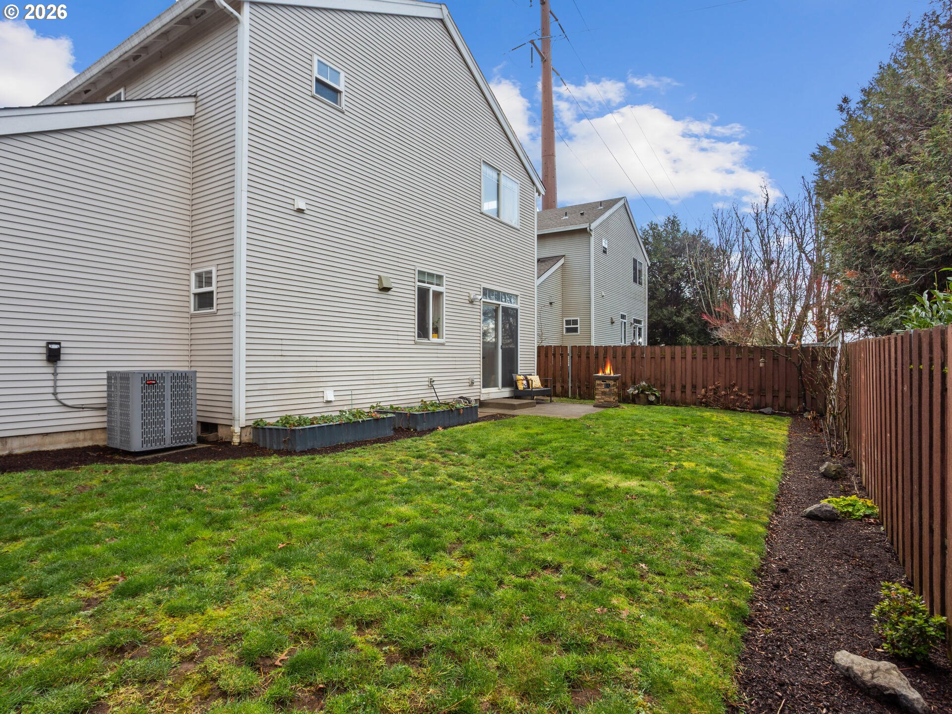 19200 Southeast 33rd Circle Camas, WA 98607 - Photo 34 of 43 a backyard of a house with table and chairs