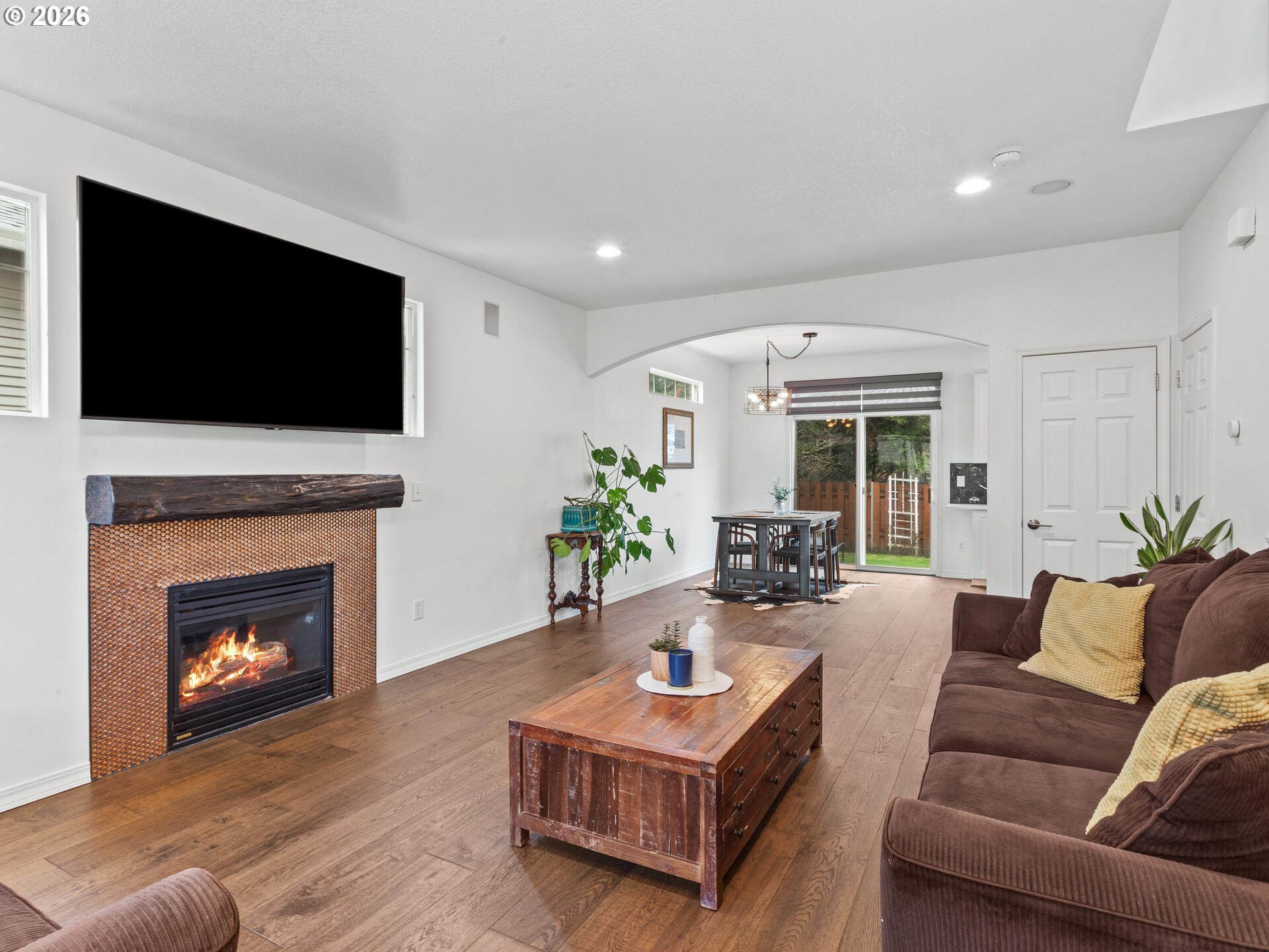 19200 Southeast 33rd Circle Camas, WA 98607 - Photo 4 of 43 a living room with furniture a flat screen tv and a fireplace