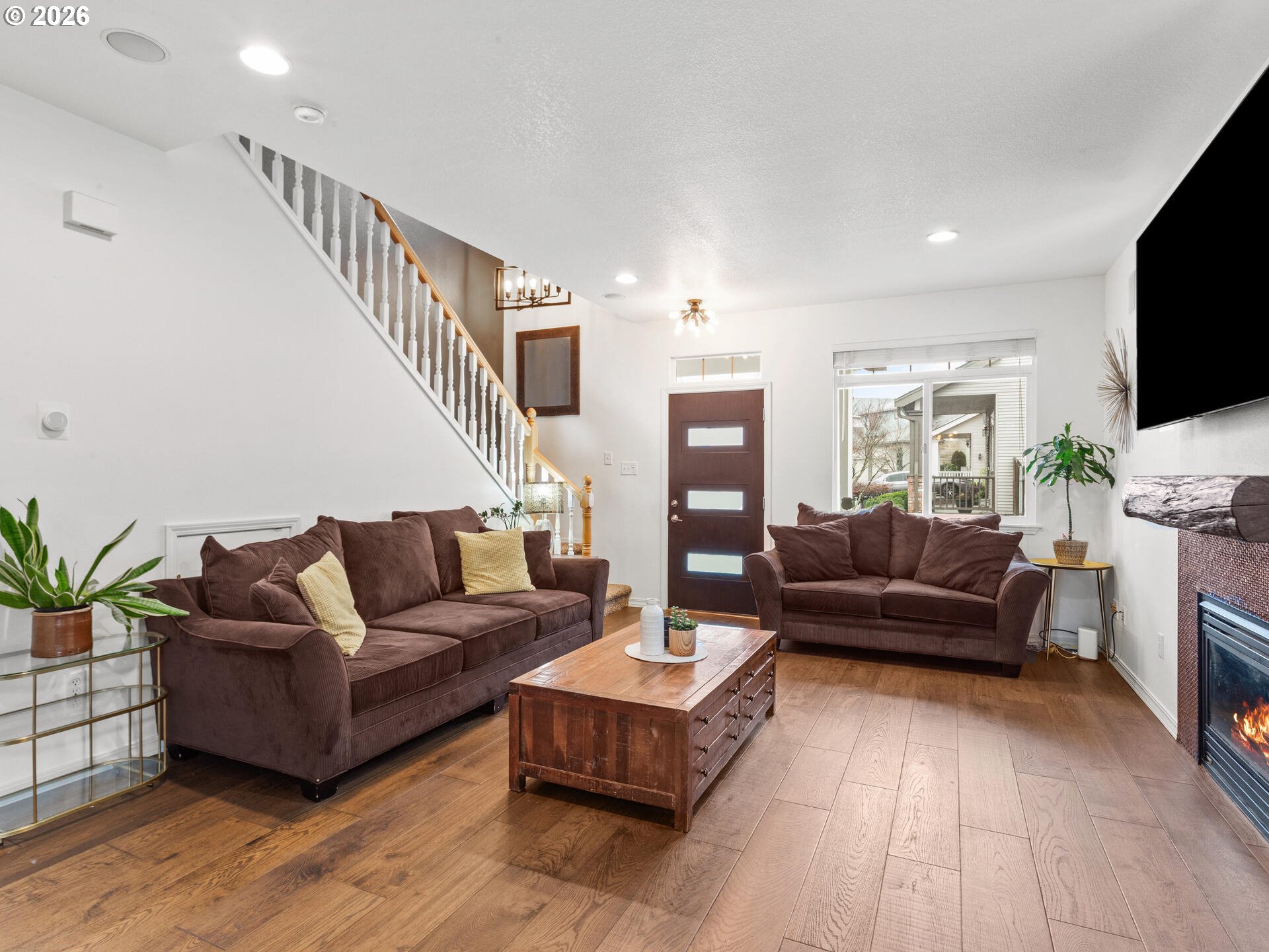 19200 Southeast 33rd Circle Camas, WA 98607 - Photo 6 of 43 a living room with fireplace furniture and a flat screen tv