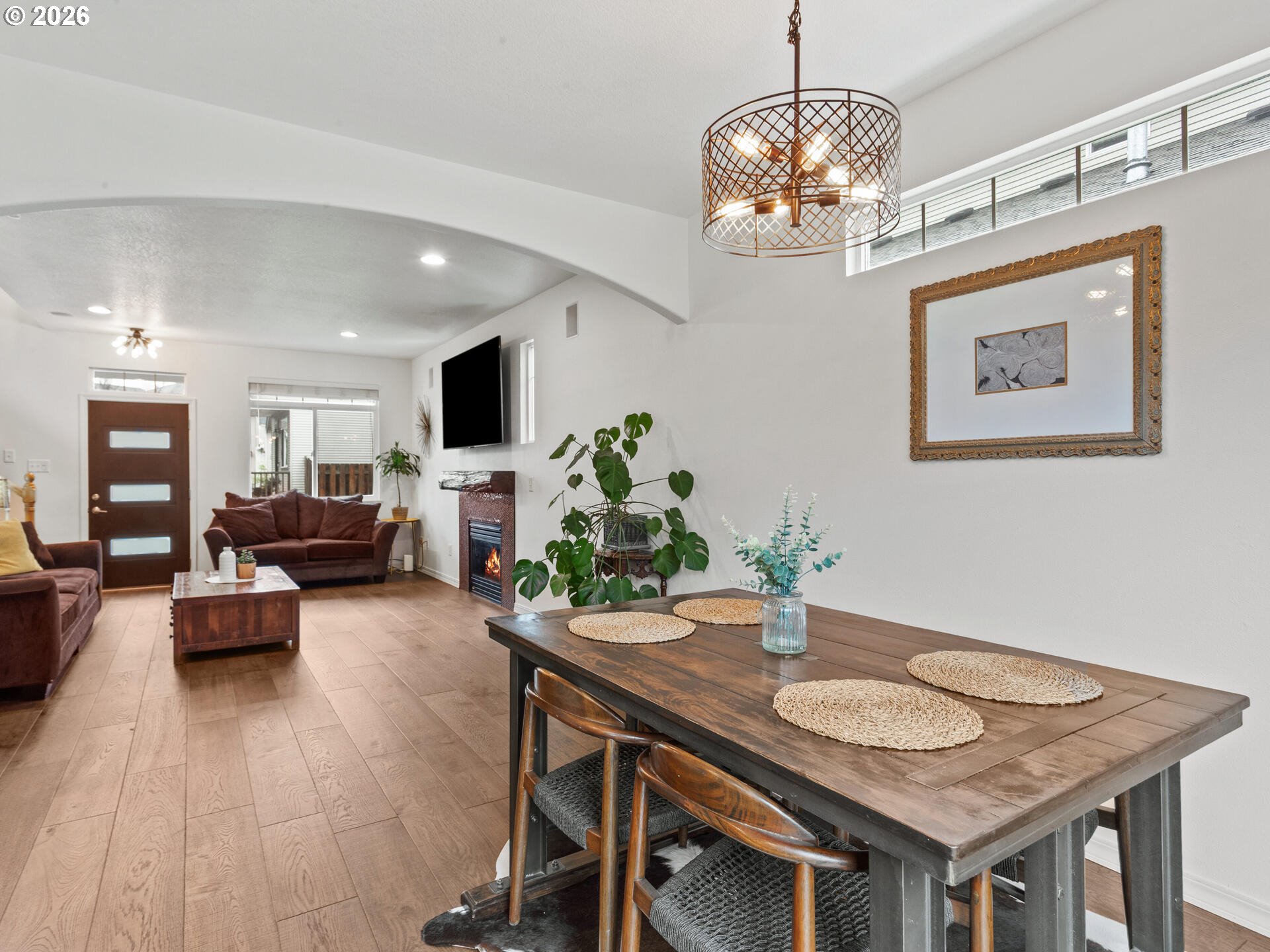 19200 Southeast 33rd Circle Camas, WA 98607 - Photo 8 of 43 a view of a dining room with furniture a chandelier and wooden floor
