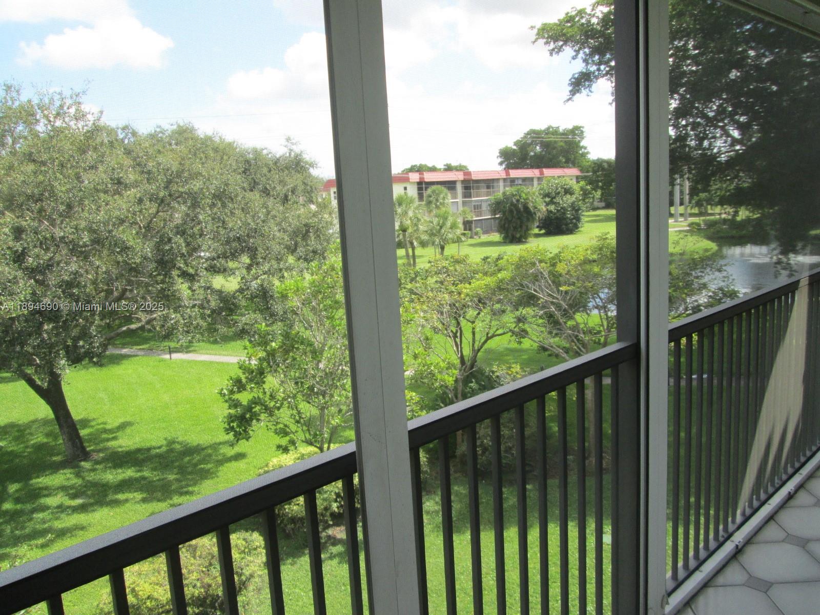150 South Hollybrook Terrace, Unit 303 Pembroke Pines, FL 33025 - Photo 13 of 18 a view of a forest from a balcony