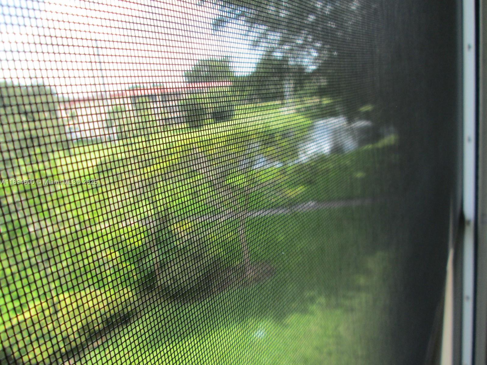 150 South Hollybrook Terrace, Unit 303 Pembroke Pines, FL 33025 - Photo 16 of 18 a view of residential space with plants