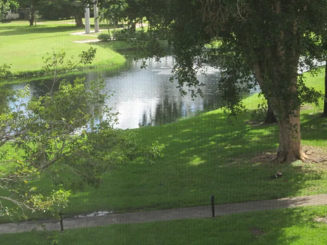 a view of a lake with a yard