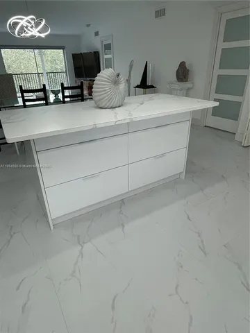 a view of counter top space with furniture