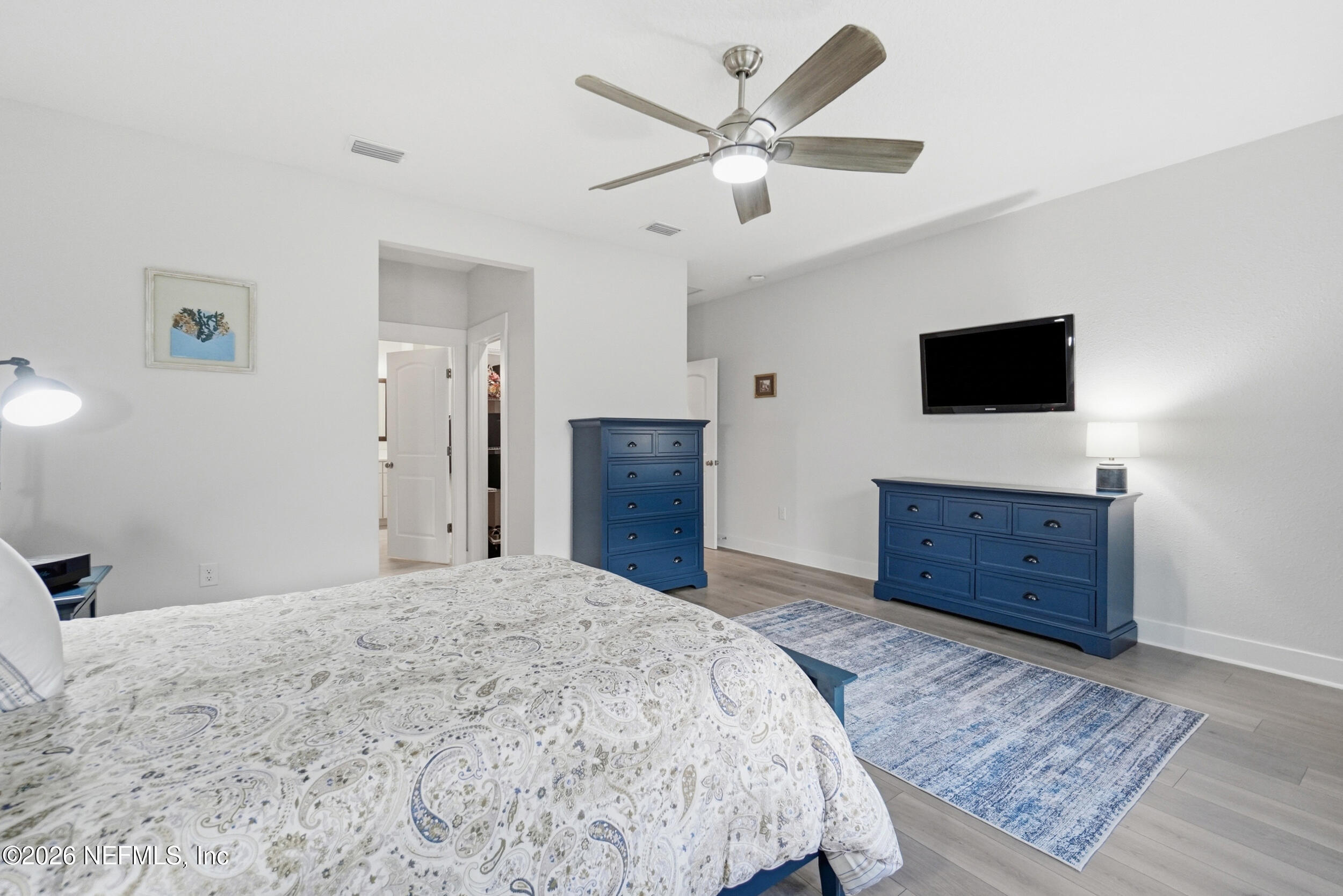 34 Red Rock Lane St. Johns, FL 32259 - Photo 24 of 71 a bedroom with a bed and a flat screen tv