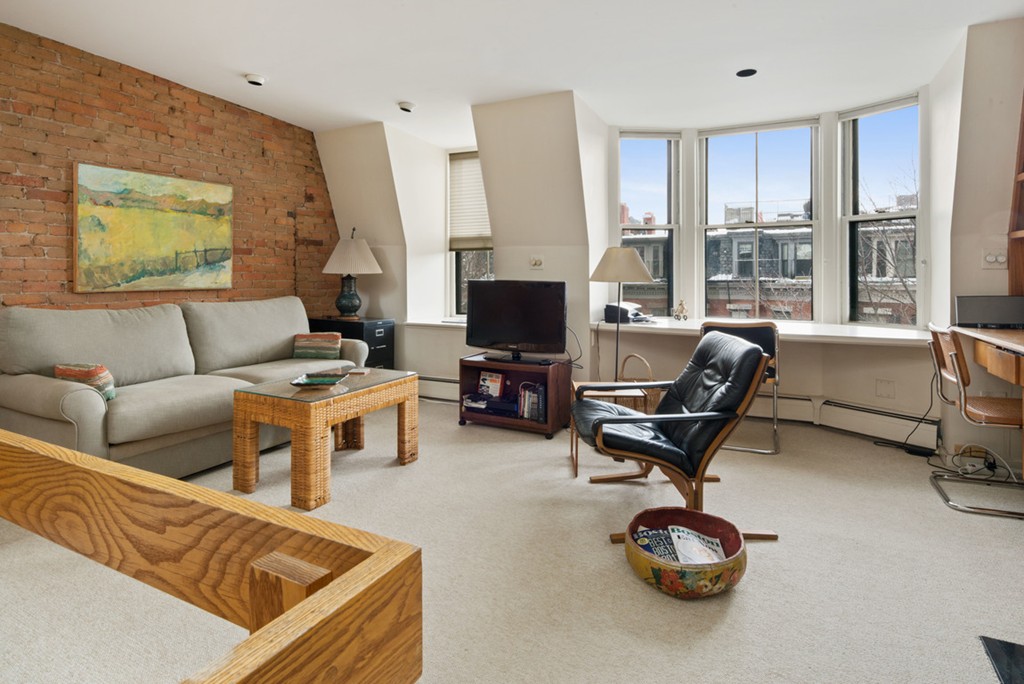 103 Appleton Street, Unit 4 Boston, MA 02116 - Photo 13 of 29 a living room with furniture and a flat screen tv