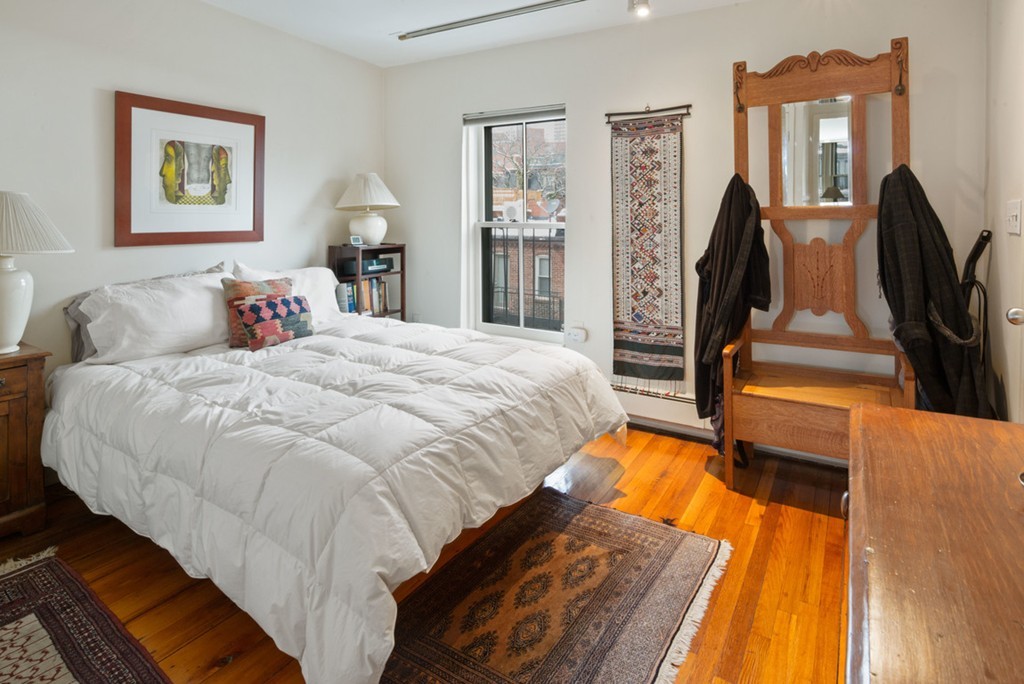103 Appleton Street, Unit 4 Boston, MA 02116 - Photo 15 of 29 a bedroom with bed and wooden floor
