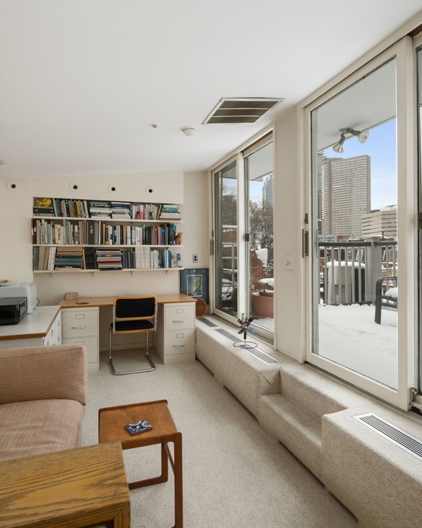 103 Appleton Street, Unit 4 Boston, MA 02116 - Photo 19 of 29 a living room with furniture and a floor to ceiling window