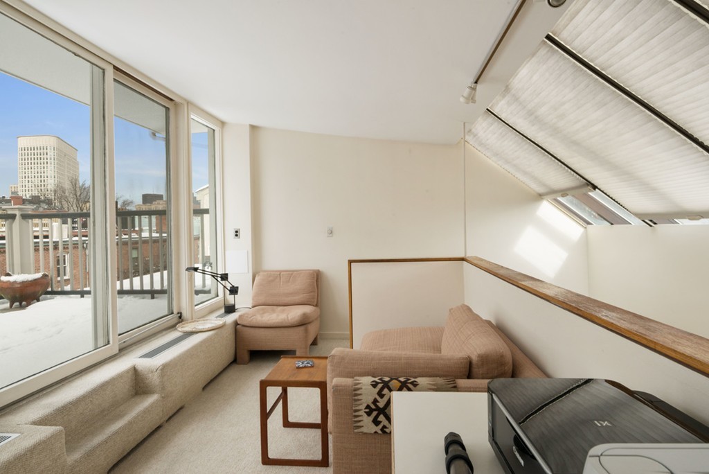 103 Appleton Street, Unit 4 Boston, MA 02116 - Photo 21 of 29 a living room with furniture and a large window