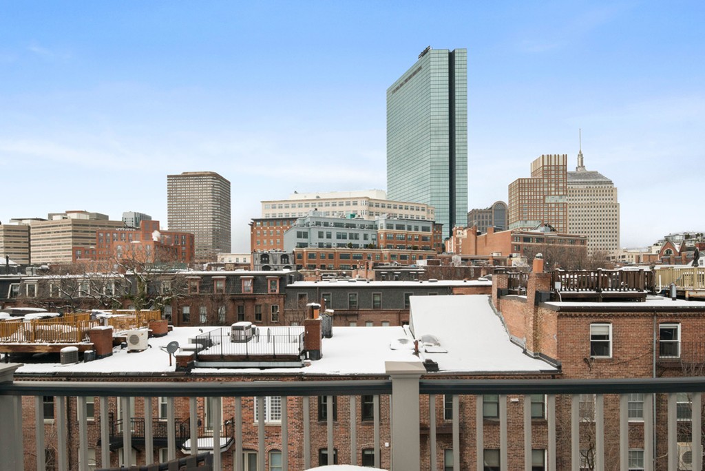103 Appleton Street, Unit 4 Boston, MA 02116 - Photo 22 of 29 a view of a city with tall buildings