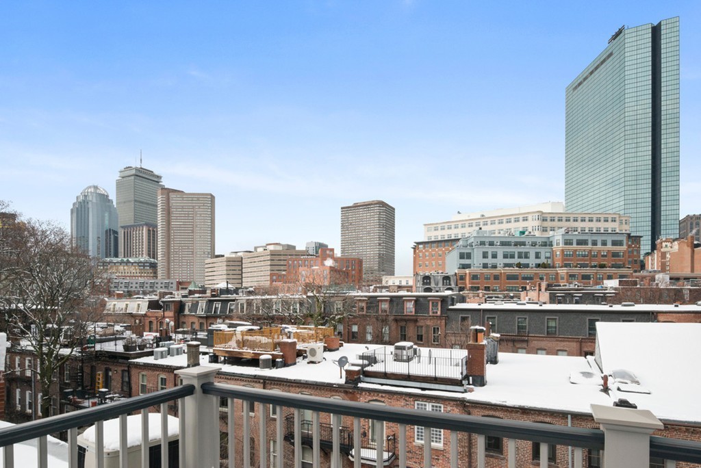 103 Appleton Street, Unit 4 Boston, MA 02116 - Photo 25 of 29 a view of a city skyline from a balcony