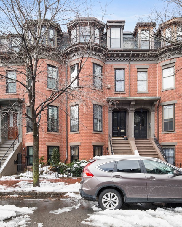 103 Appleton Street, Unit 4 Boston, MA 02116 - Photo 27 of 29 a view of a car parked in front of a brick building