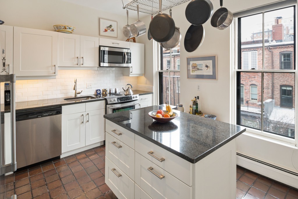 103 Appleton Street, Unit 4 Boston, MA 02116 - Photo 4 of 29 a kitchen with stainless steel appliances granite countertop a sink and a stove