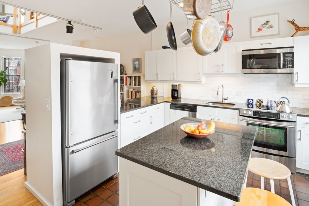 103 Appleton Street, Unit 4 Boston, MA 02116 - Photo 5 of 29 a kitchen with a refrigerator a stove and a sink