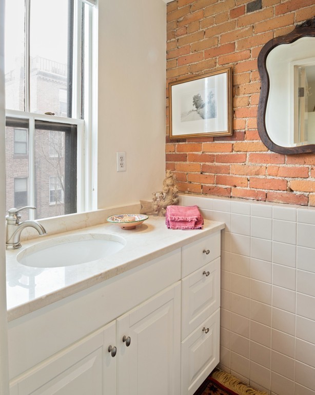 103 Appleton Street, Unit 4 Boston, MA 02116 - Photo 7 of 29 a bathroom with a sink and a mirror