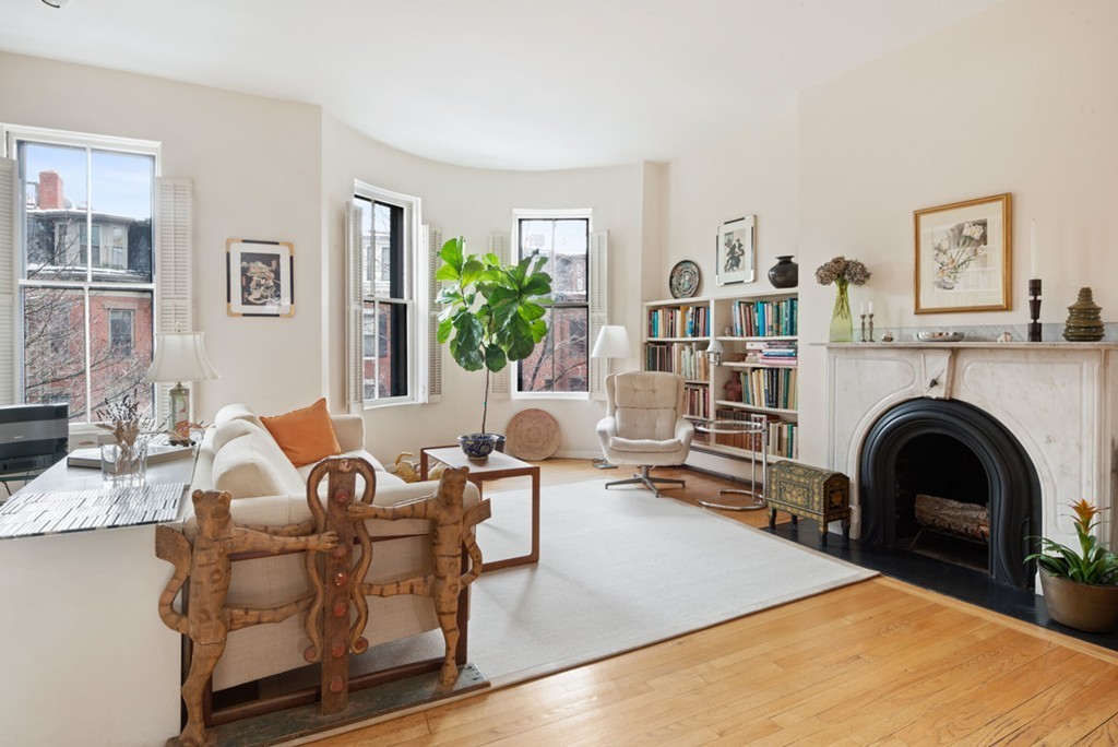 103 Appleton Street, Unit 4 Boston, MA 02116 - Photo 10 of 29 a living room with furniture and a fireplace