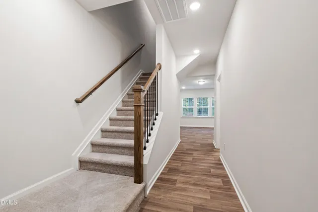 a view of a hallway with stairs